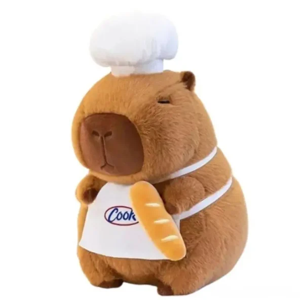 Peluche Capybara Chef brune douce, toque blanche, tablier Cook, tenant une baguette.