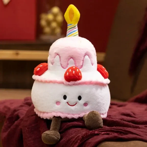 Peluche gâteau aux fraises rose façon Jelly, visage souriant, bougie et jambes.