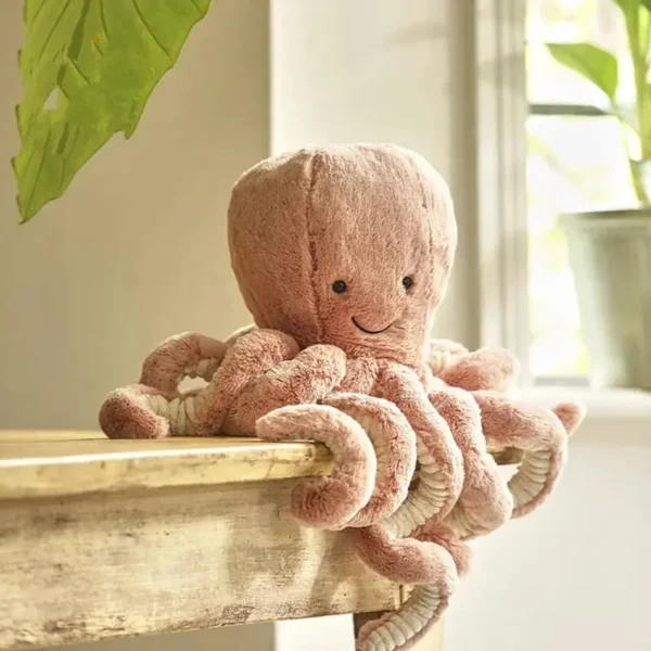 Peluche pieuvre rose poudré design Jellycat, tissu doux et côtelé, 49cm.