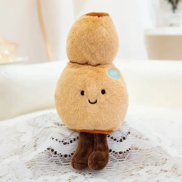 Peluche Racine de Lotus marron Jellycat, douce, yeux brodés, écusson bleu.