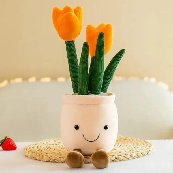 Peluche tulipe orange en pot style Jellycat, visage mignon, sur dessous-de-plat paille.