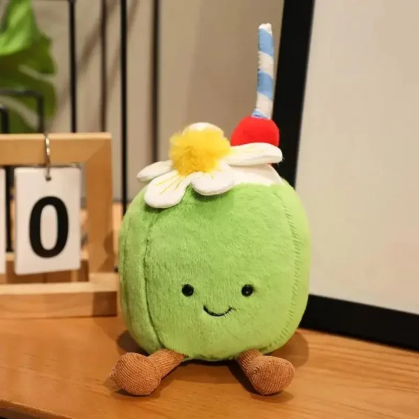 Peluche Coco verte façon Jellycat , Kawaii, avec fleur, cerise et paille tropicale.