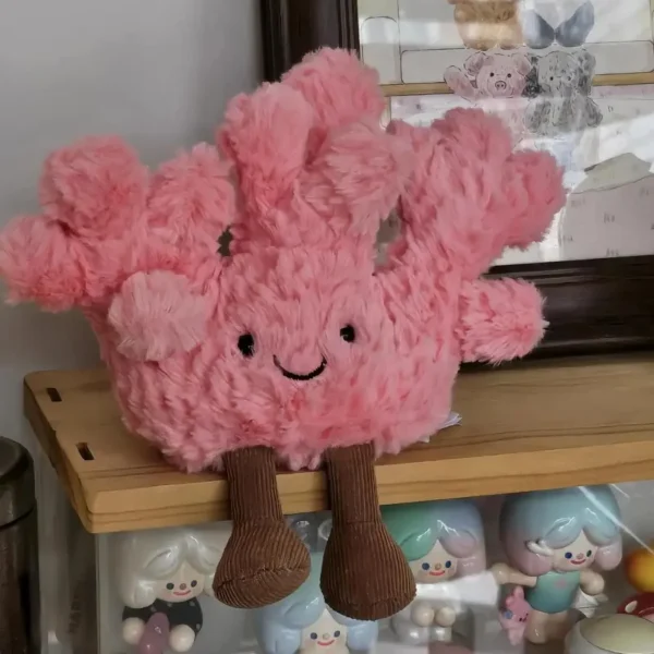 Peluche Corail rose vif, design façon Jelly, fourrure shaggy, jambes velours marron.