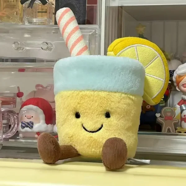 Peluche Limonade jaune type Jellycat Amuseables avec paille, citron et jambes.